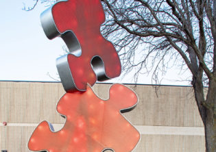 puzzle piece University Connection light feature sculpture