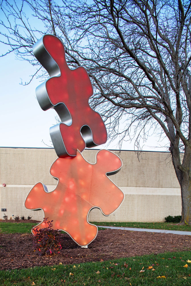 puzzle piece University Connection light feature sculpture